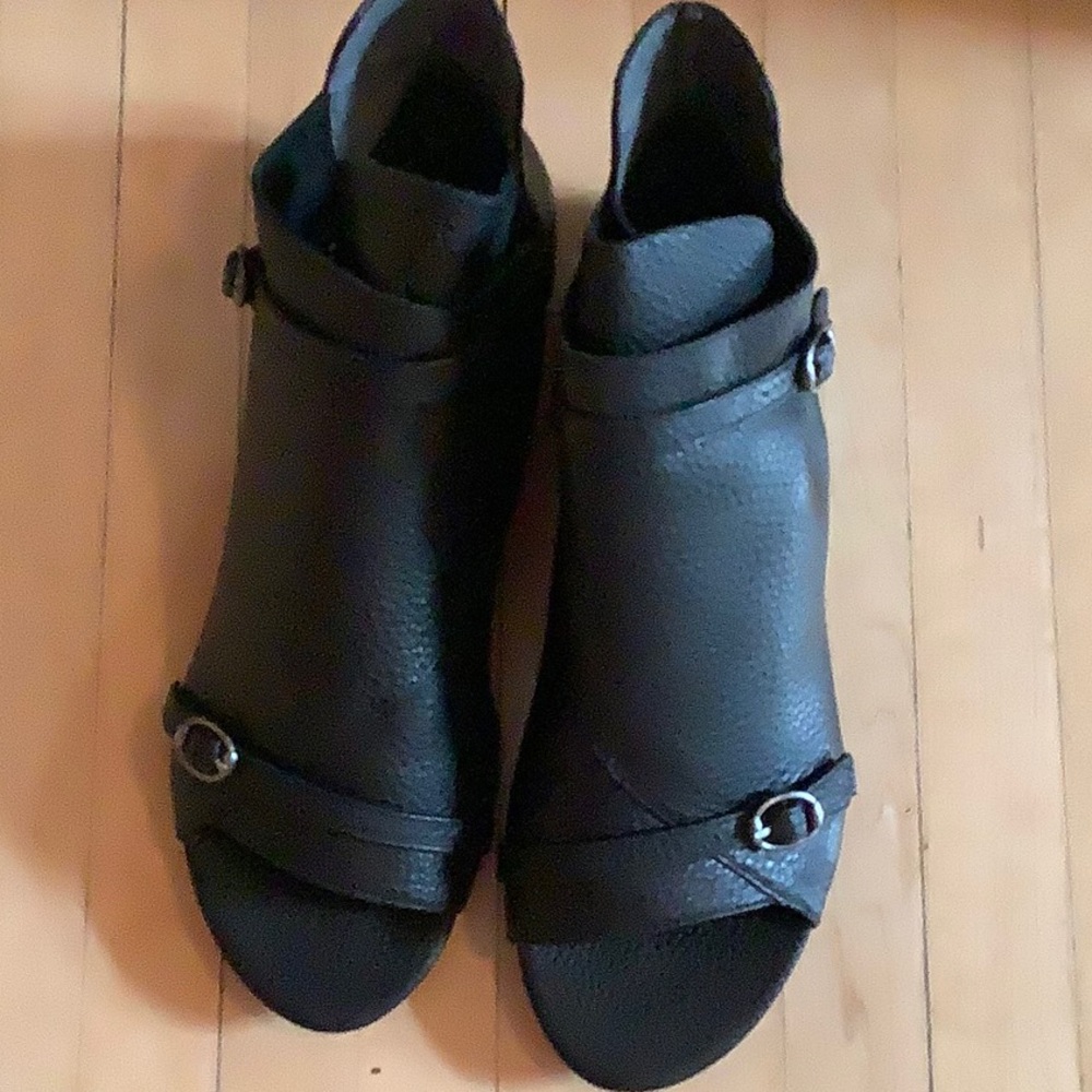 Flat Sandal like shoe with open toe.  Size 7.5